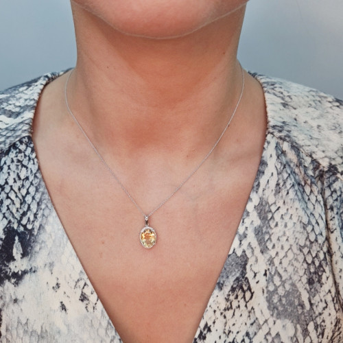 Golden pendant with precious stones