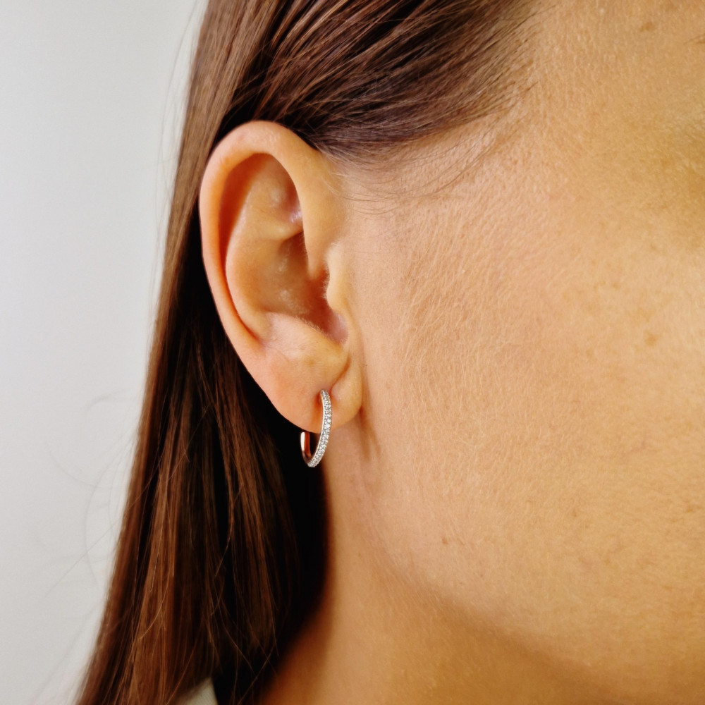 Golden earrings with precious stones