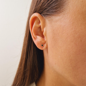 Gold earrings with a black diamond