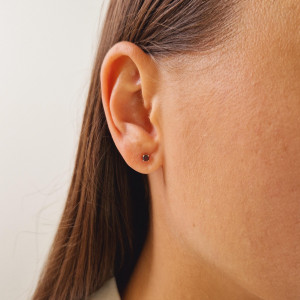 Gold earrings with a black diamond