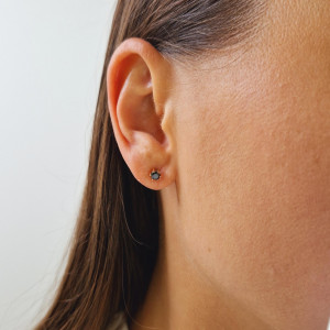 Gold earrings with a black diamond