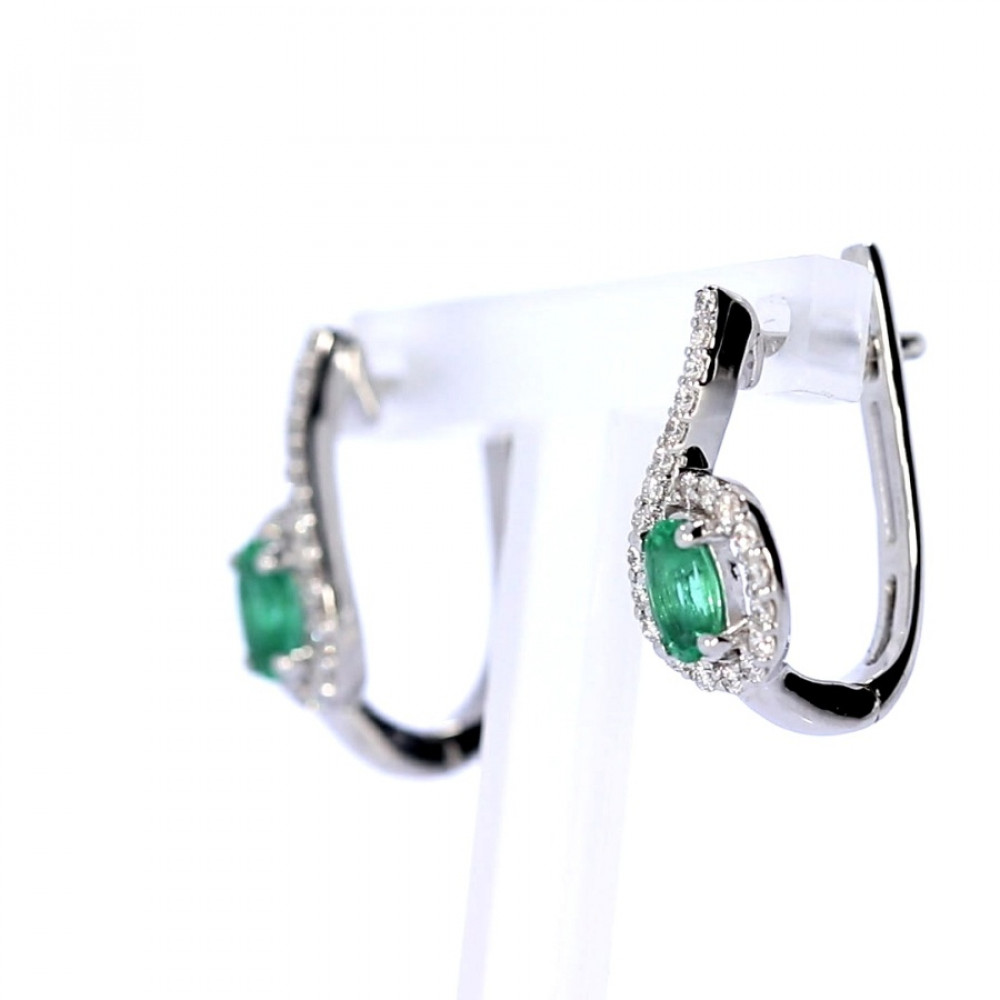 Gold earrings with emerald