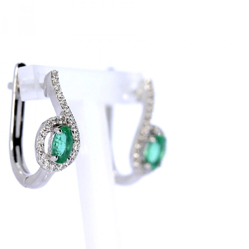 Gold earrings with emerald