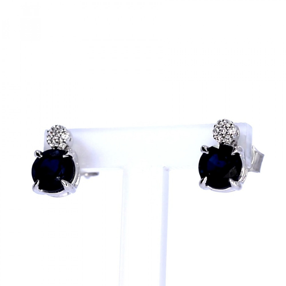 Golden earrings with precious stones