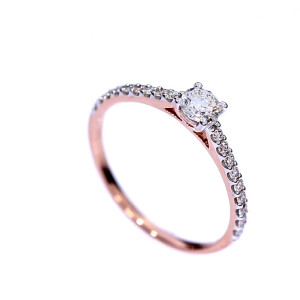 Golden ring with precious stones