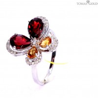 Golden ring with precious stones