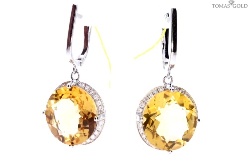 Golden earrings with precious stones